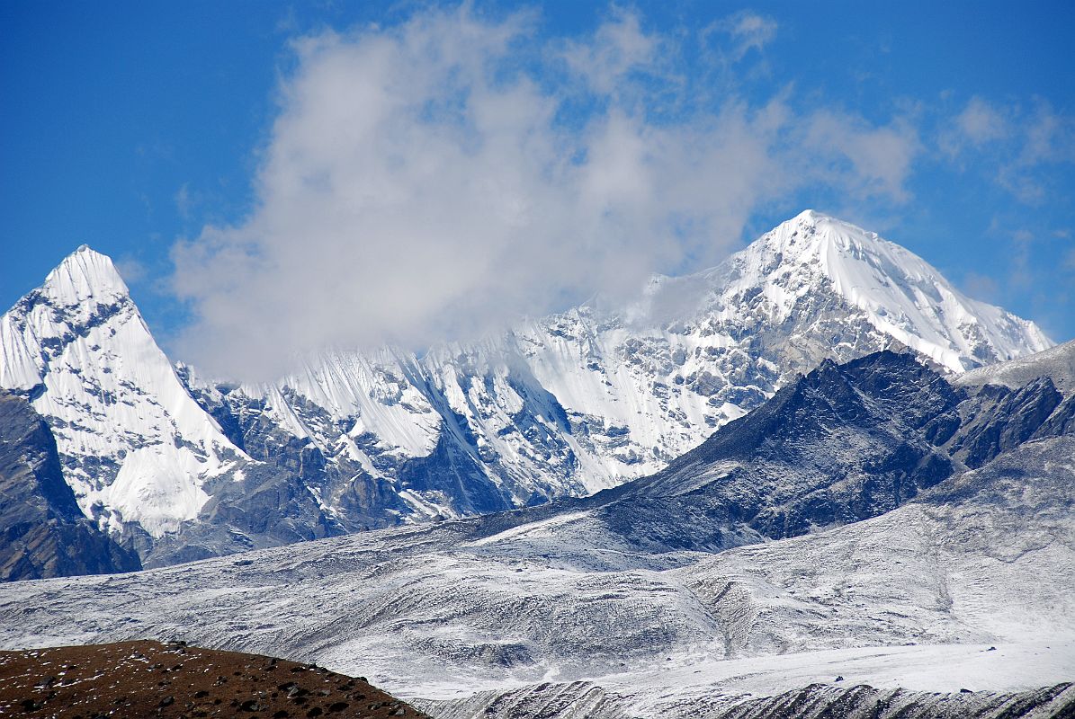 10 Triangle And Pemthang Ri From Taro Tso Triangle (6600m) and Pemthang Ri (6842m) from Tara Tso. The trail to Advanced Base Camp goes around the ridge between the two mountains.